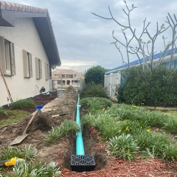 Underground drainage line and catch basin being installed
